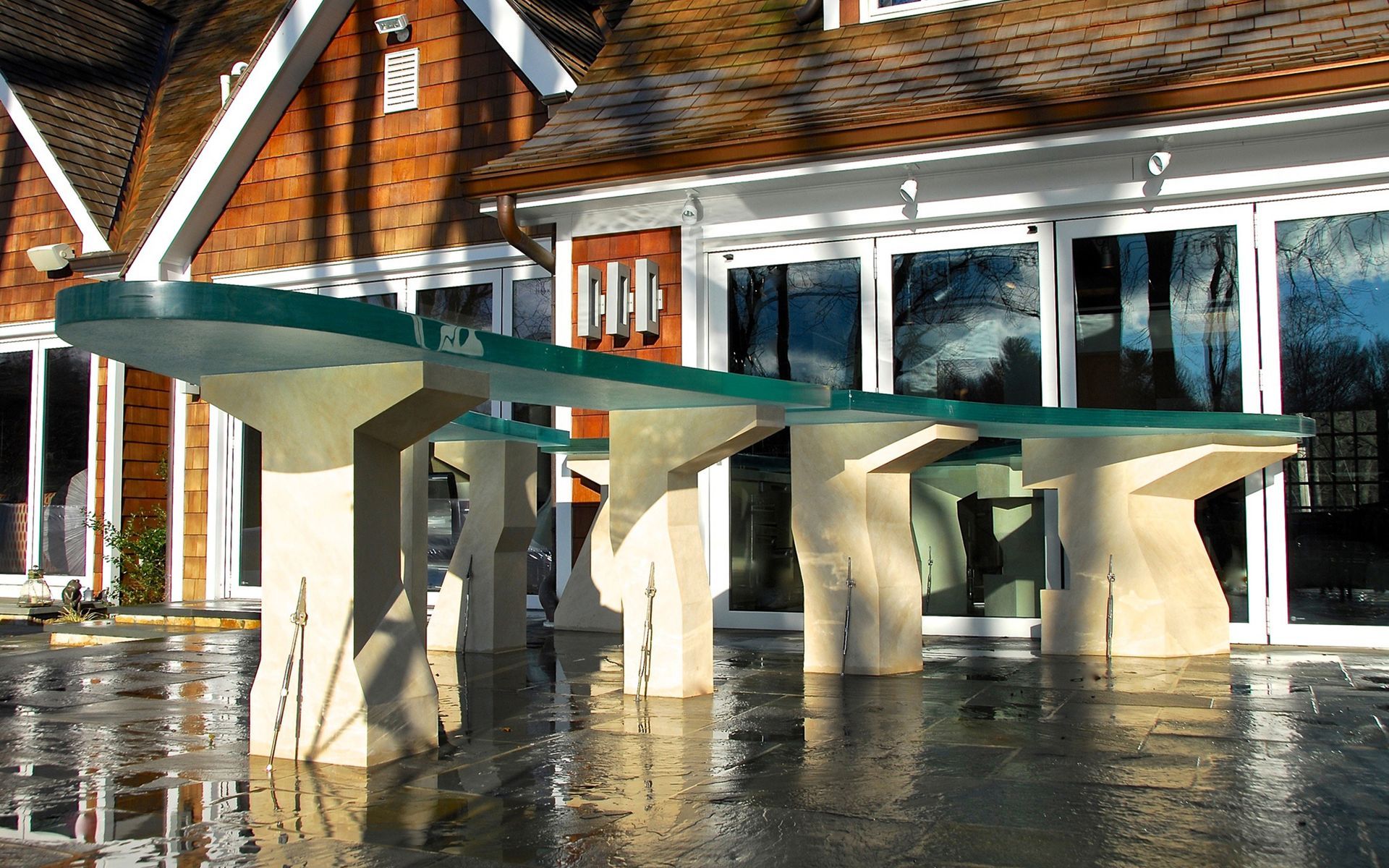 A outdoor patio with a brick building in the background