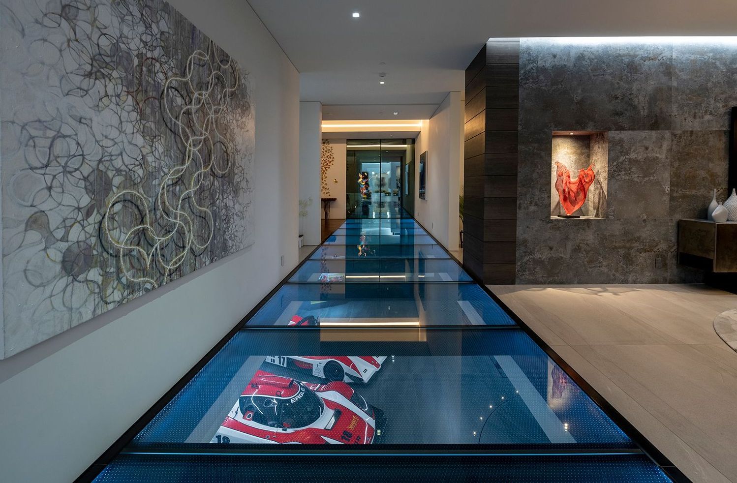 Glass floor with anti-slip coating revealing cars underneath