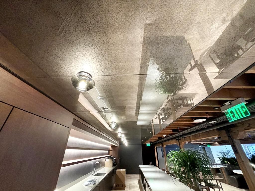 A restaurant with an antique mirror ceiling.