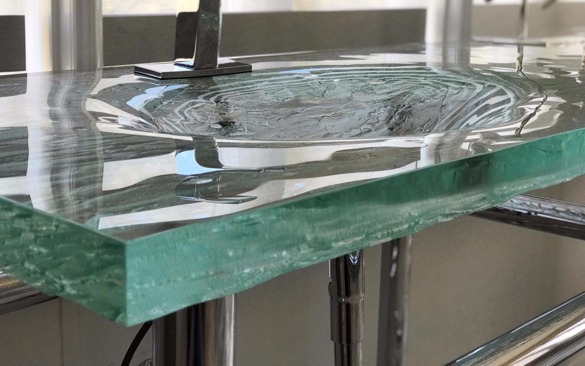 A thick glass vanity sink.
