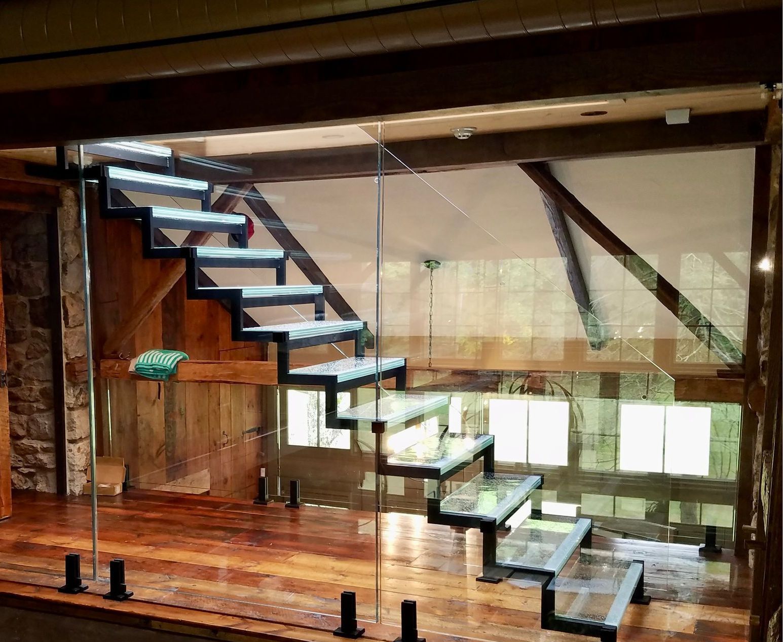 glass staircase in barn