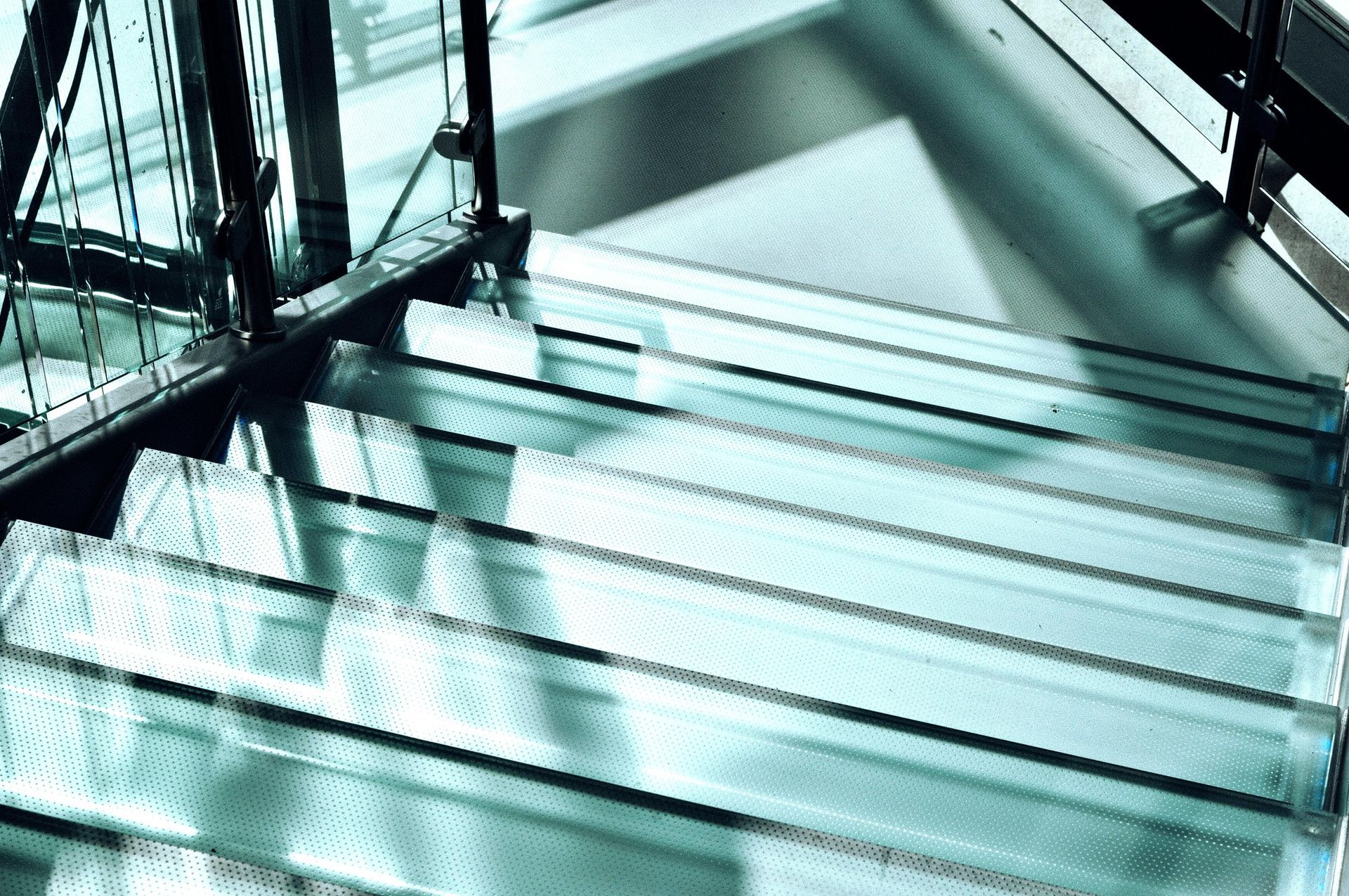 A close up of a glass floor staircase in a building