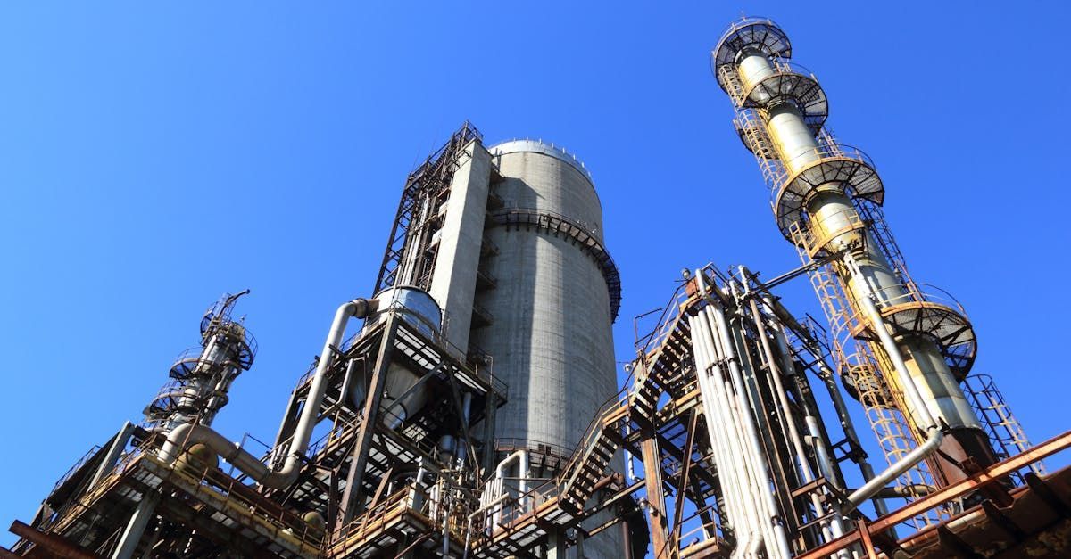 Biobusters | A large industrial plant with a blue sky in the background.