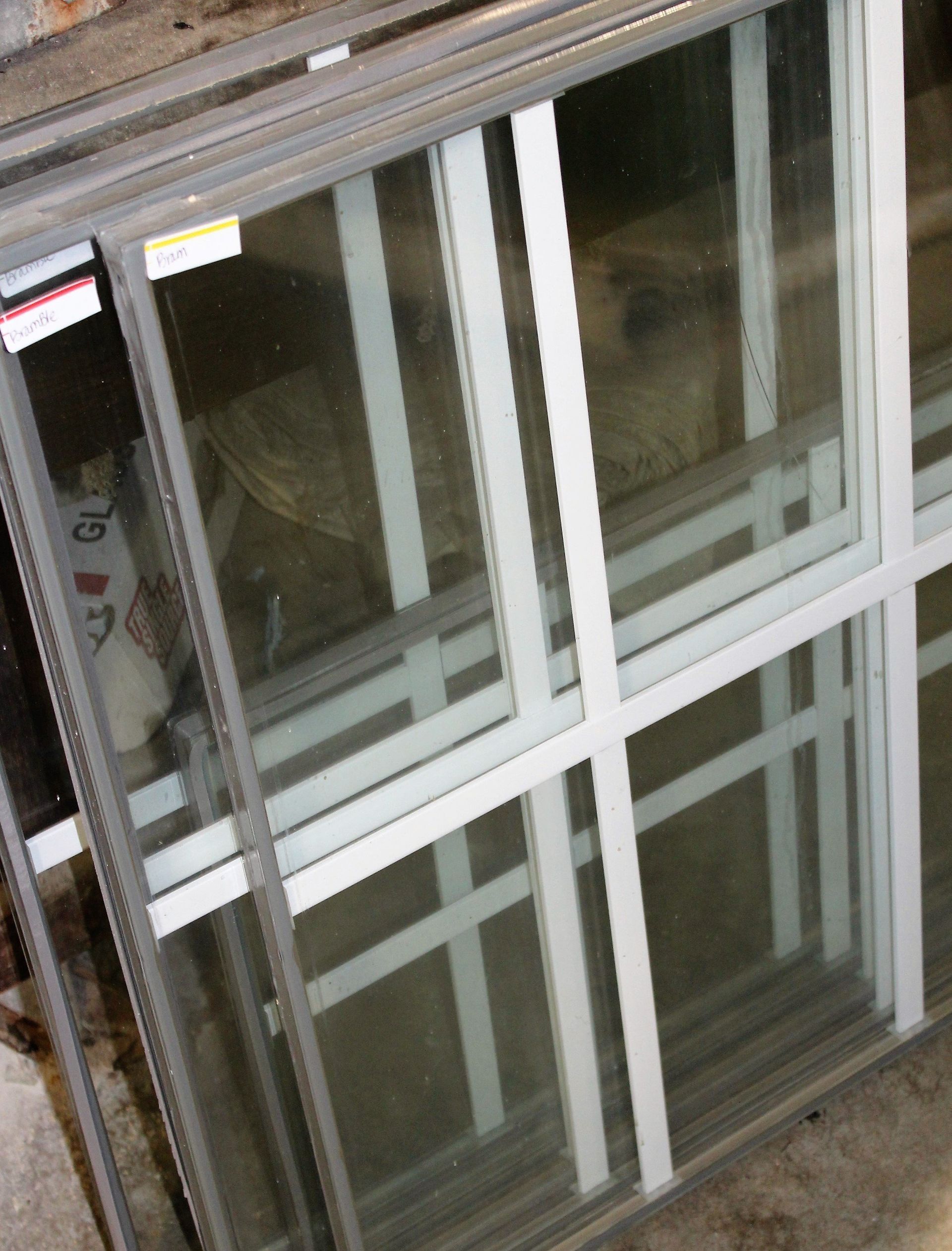 A stack of sliding glass doors with the number 10 on them