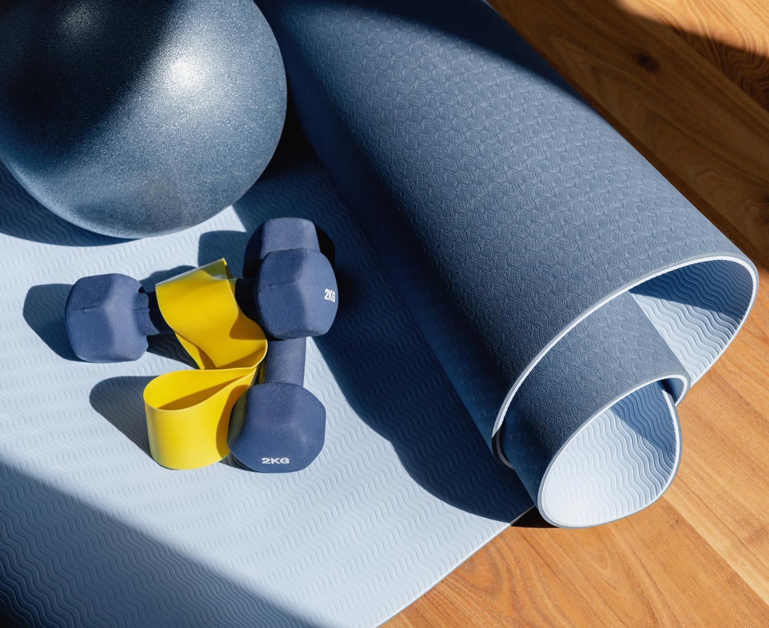 Yoga Equipment on a Wooden Floor Yoga Equipment on a Wooden Floor