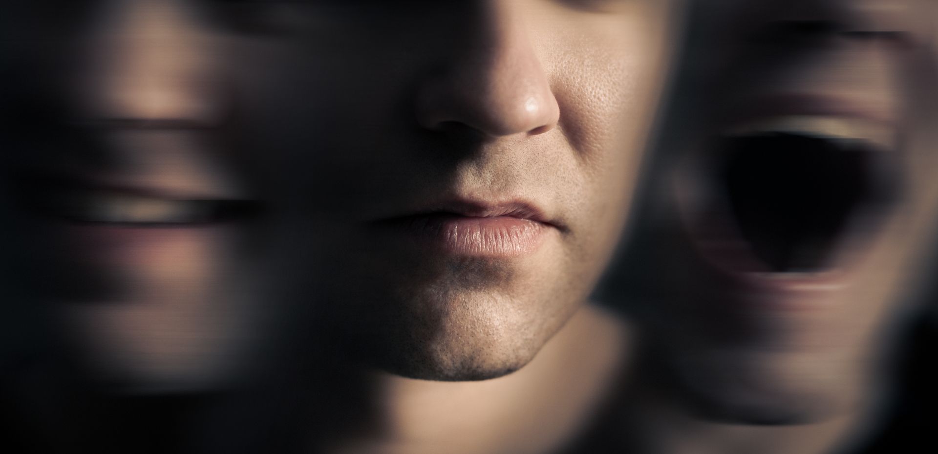 Close-up of a person's face showing various expressions: neutral, smiling, and screaming, with blur effect.
