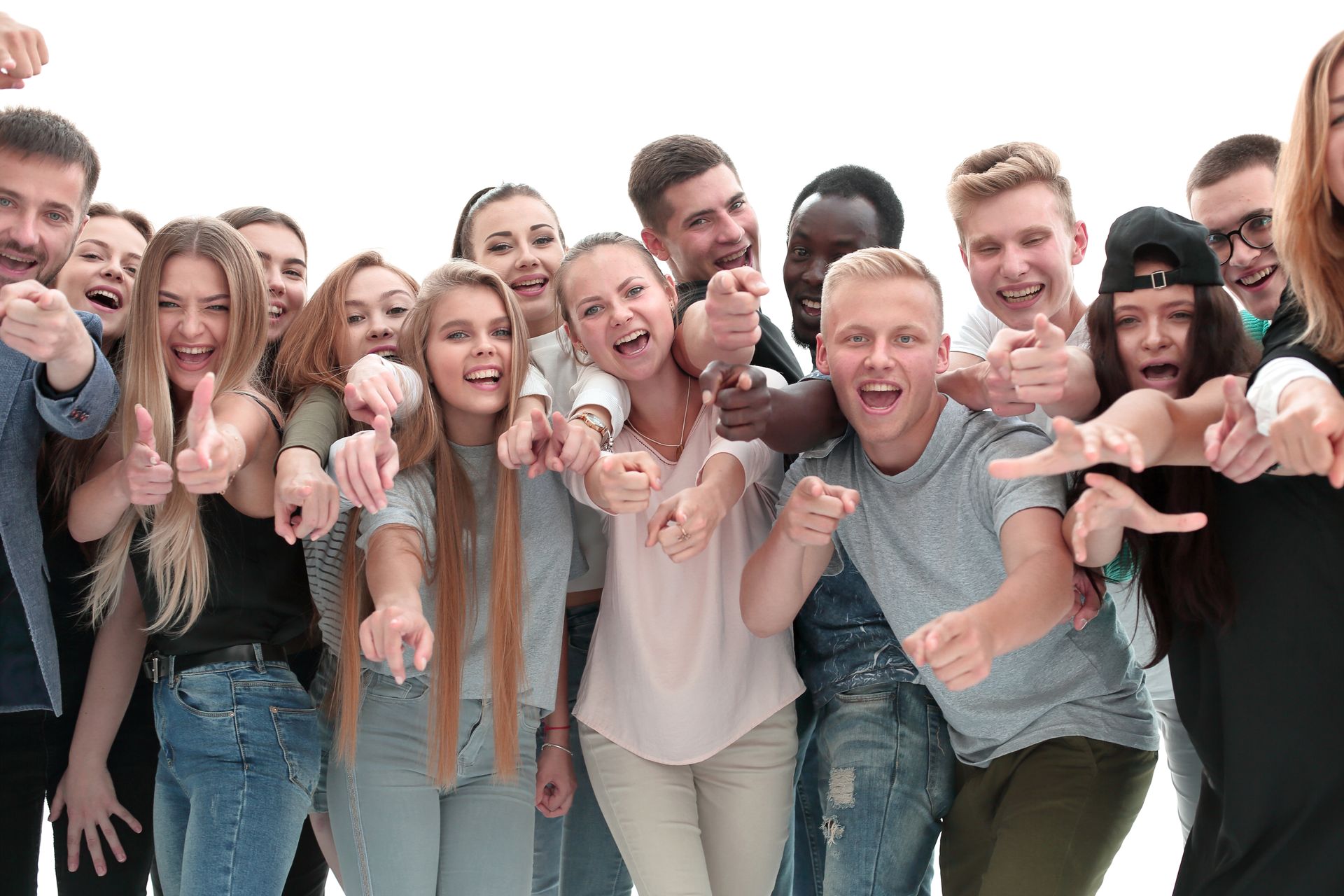 Group of young people smiling, pointing, and giving thumbs up against a white background.