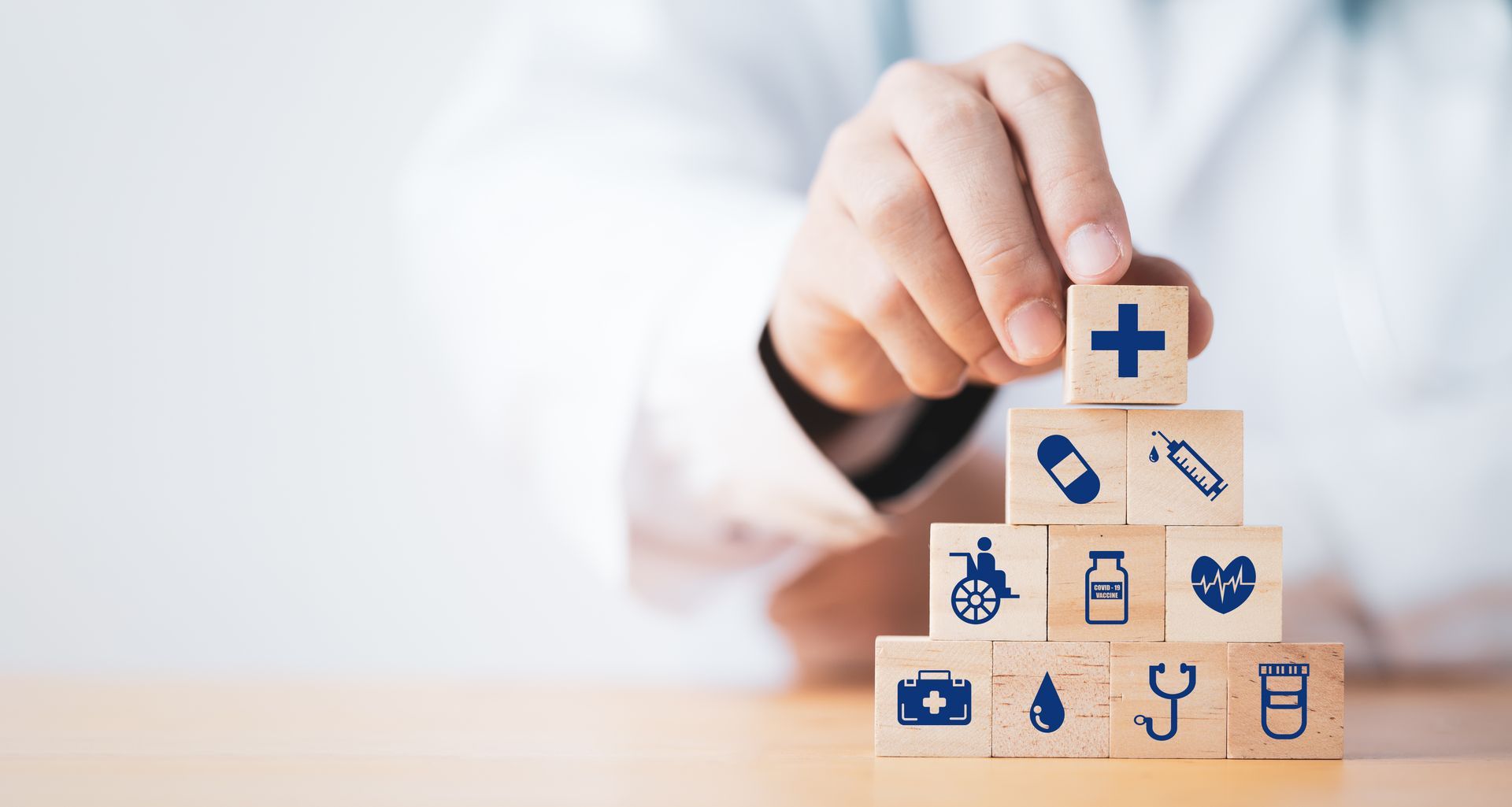 Doctor measuring patient's waist in a bright office. Fruits on desk. Doctor measuring patient's waist in a bright office. Fruits on desk.