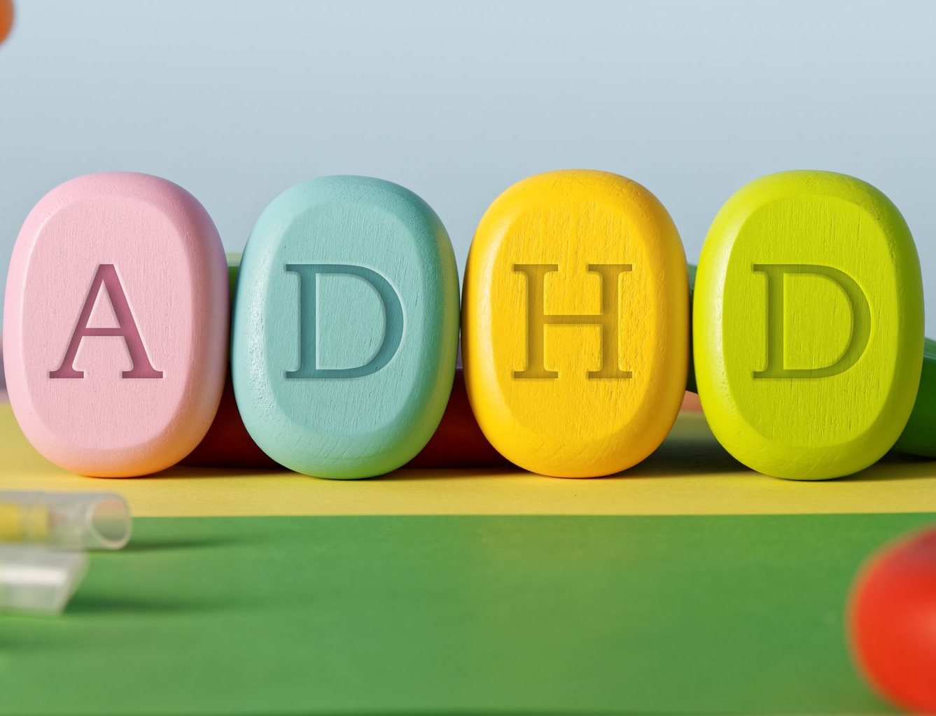 Doctor smiling at patient; examining notes. Laptop and fruits on desk. Doctor smiling at patient; examining notes. Laptop and fruits on desk.