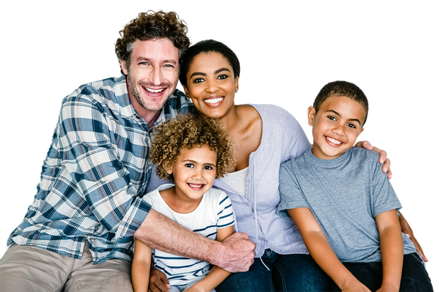 A family is posing for a picture while sitting on a couch.