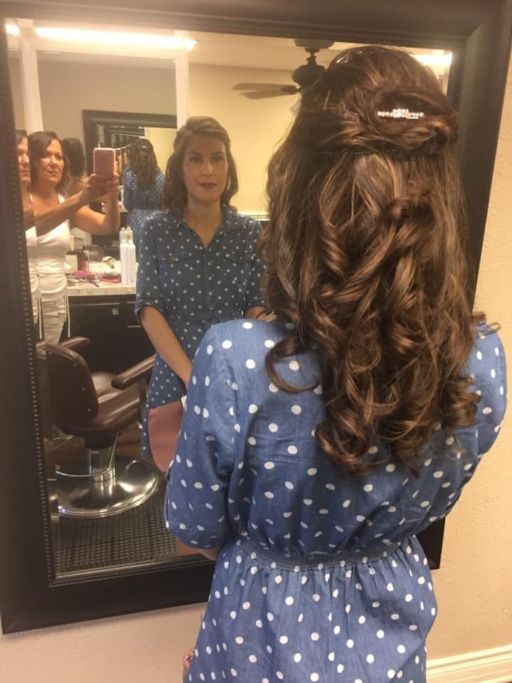 A woman is taking a picture of herself in a mirror.