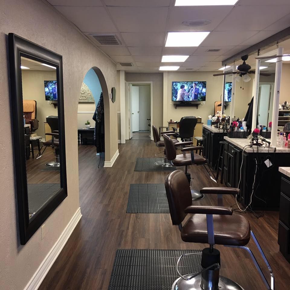 A hair salon with a lot of chairs and mirrors