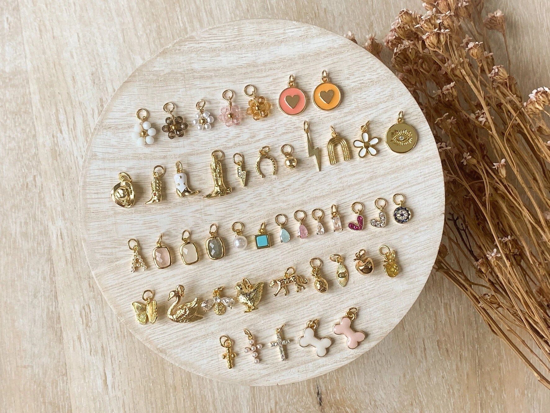 A person wearing a gold chain ring on their finger