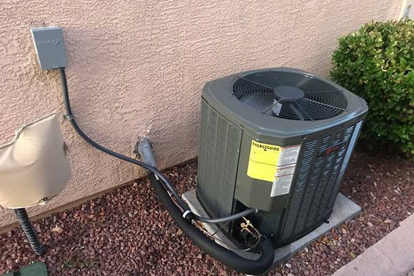 A close up of a heater with a lot of wires coming out of it.