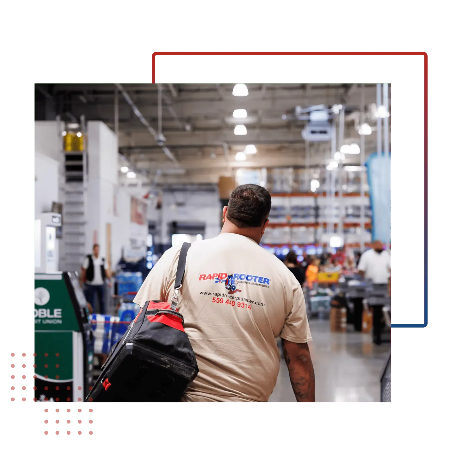 A man is walking through a warehouse with a bag on his back.