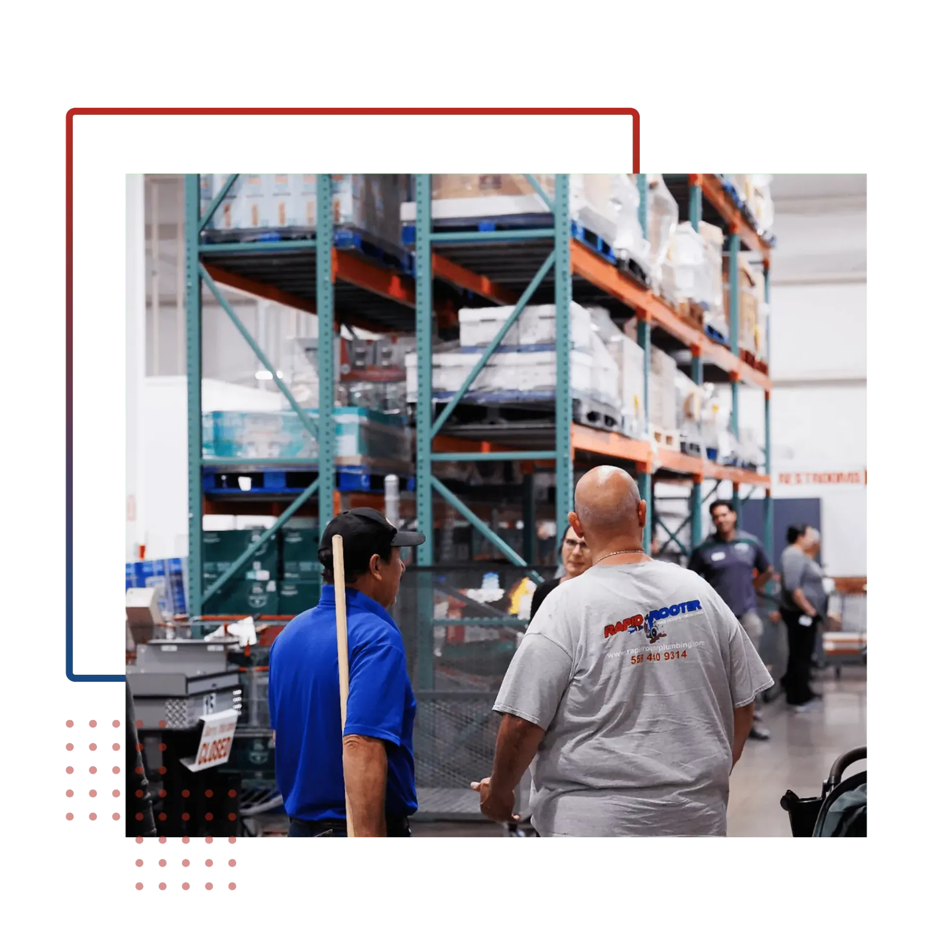 A group of men are standing in a warehouse talking to each other.