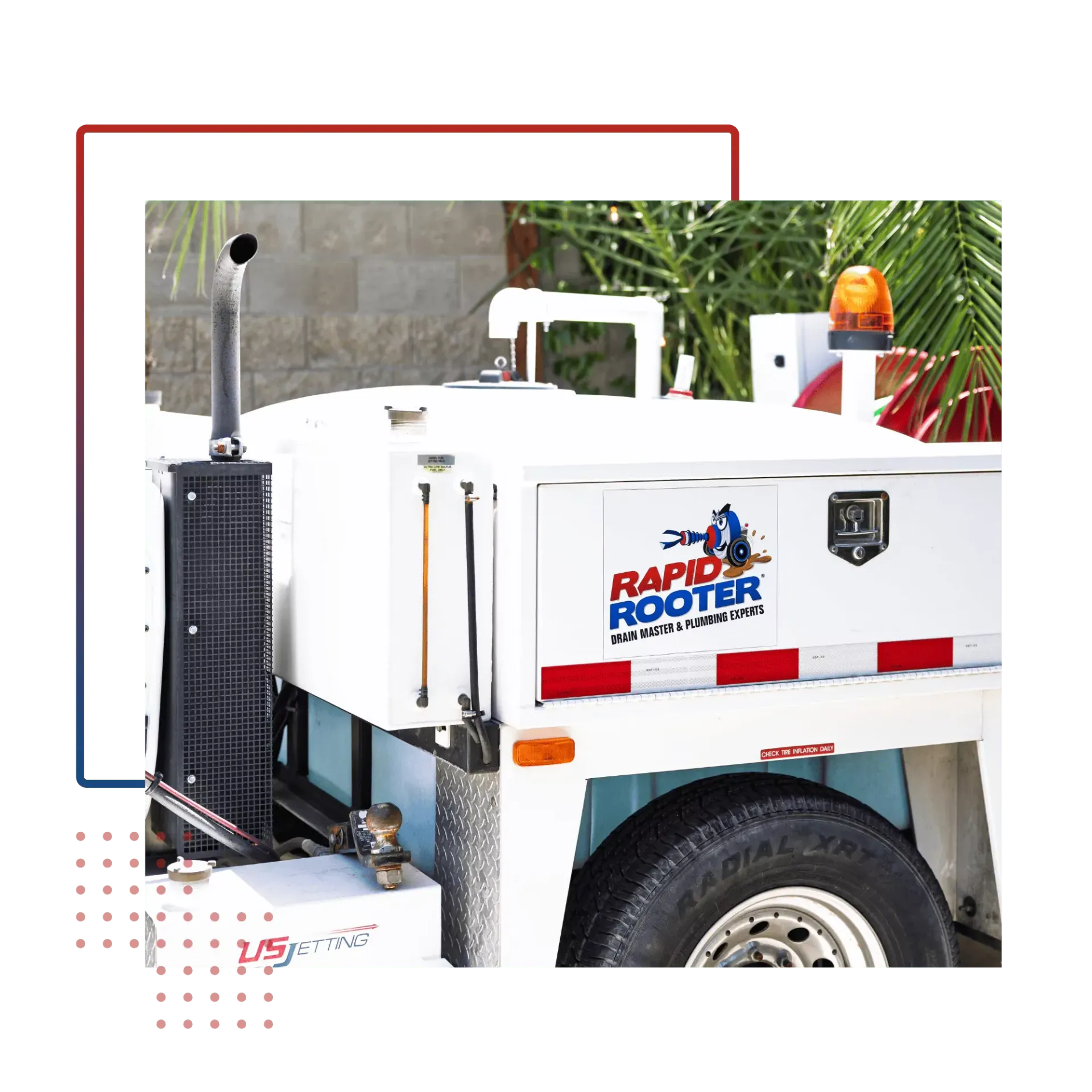 A white truck with a rapid rooter sticker on the side.
