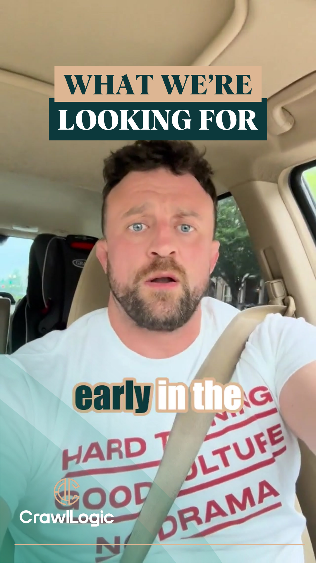 A man is sitting in a car wearing a t-shirt that says early in the g
