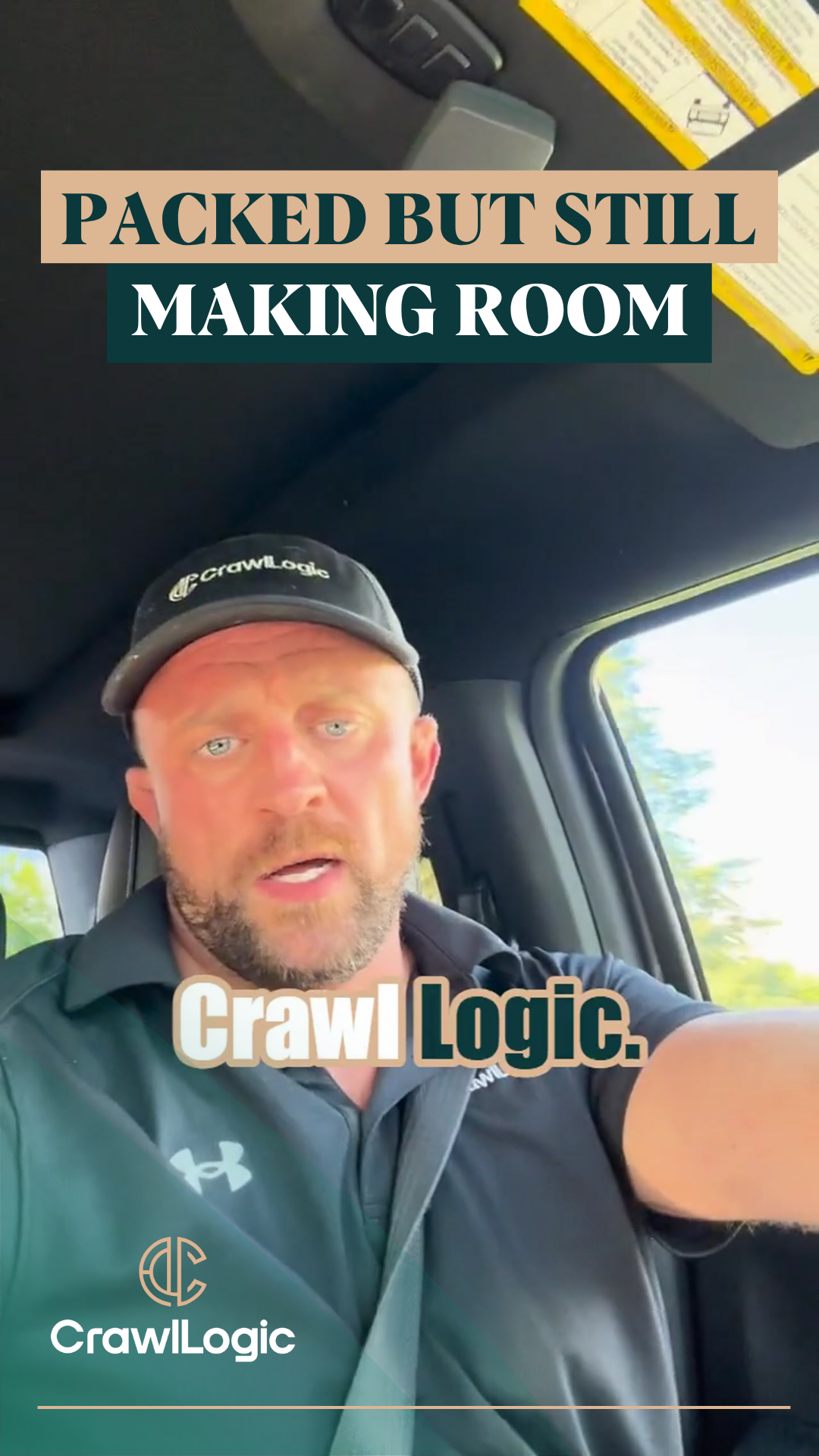 A man is sitting in the driver 's seat of a car.