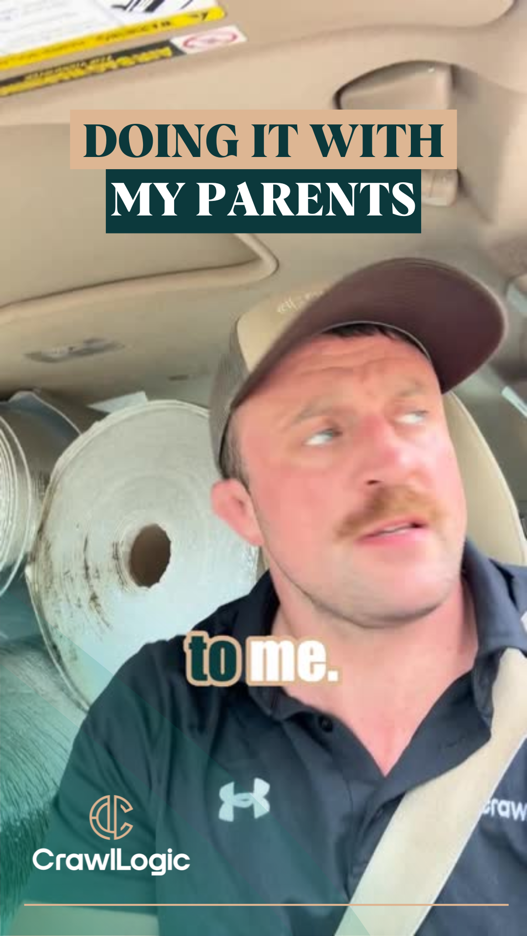 A man with a mustache is sitting in a car talking to his parents.
