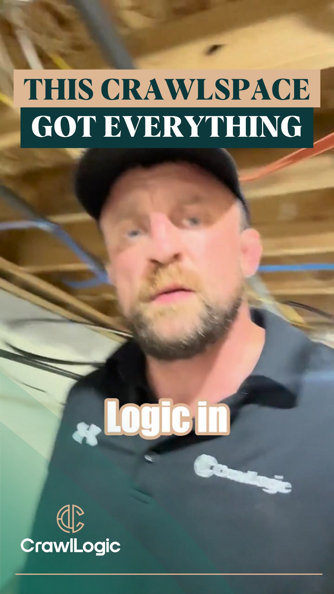 A man in a black shirt and hat is standing in a basement.