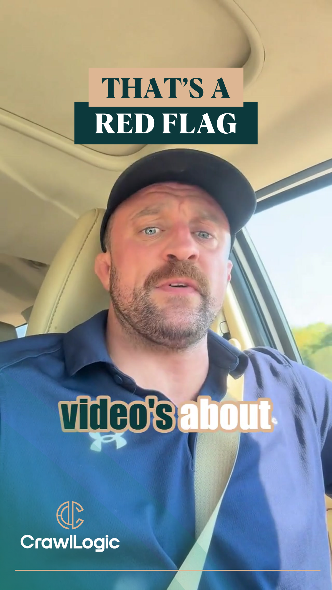 Man in car wearing a black cap, blue shirt, says 