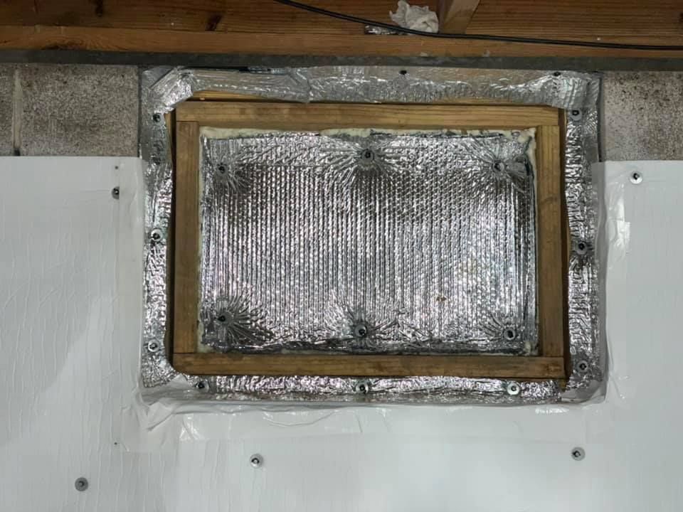 A picture frame is sitting on top of a white wall.