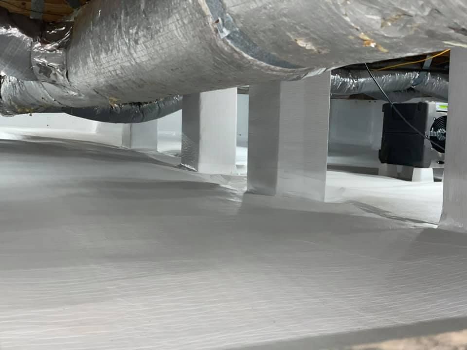 A large pipe is hanging from the ceiling of a building.