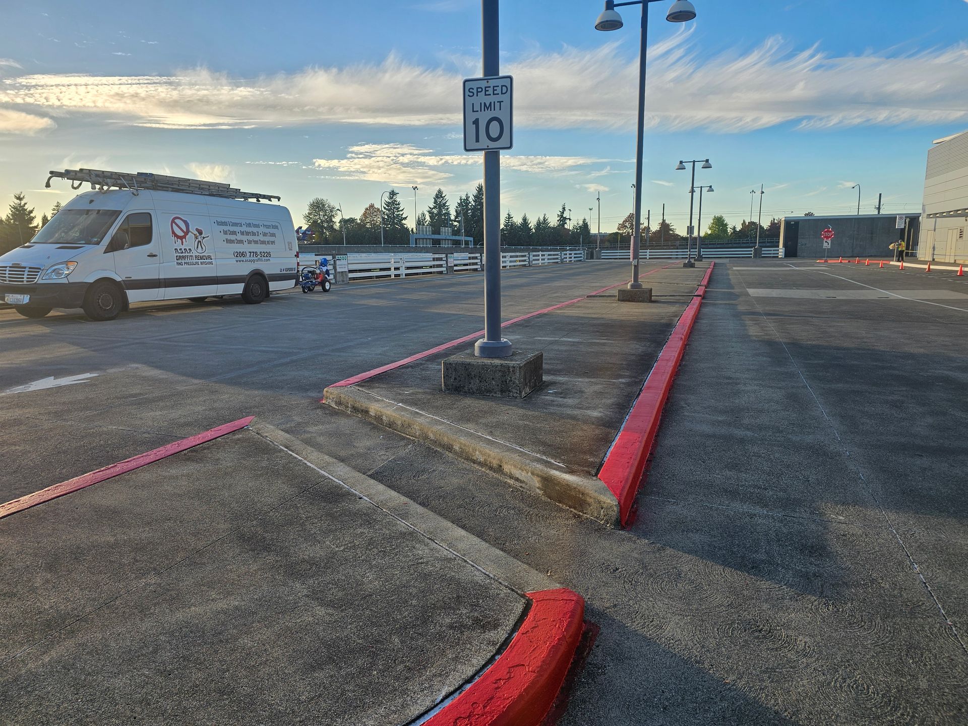 Cracked and damaged concrete driveway with large fissures running across the surface.