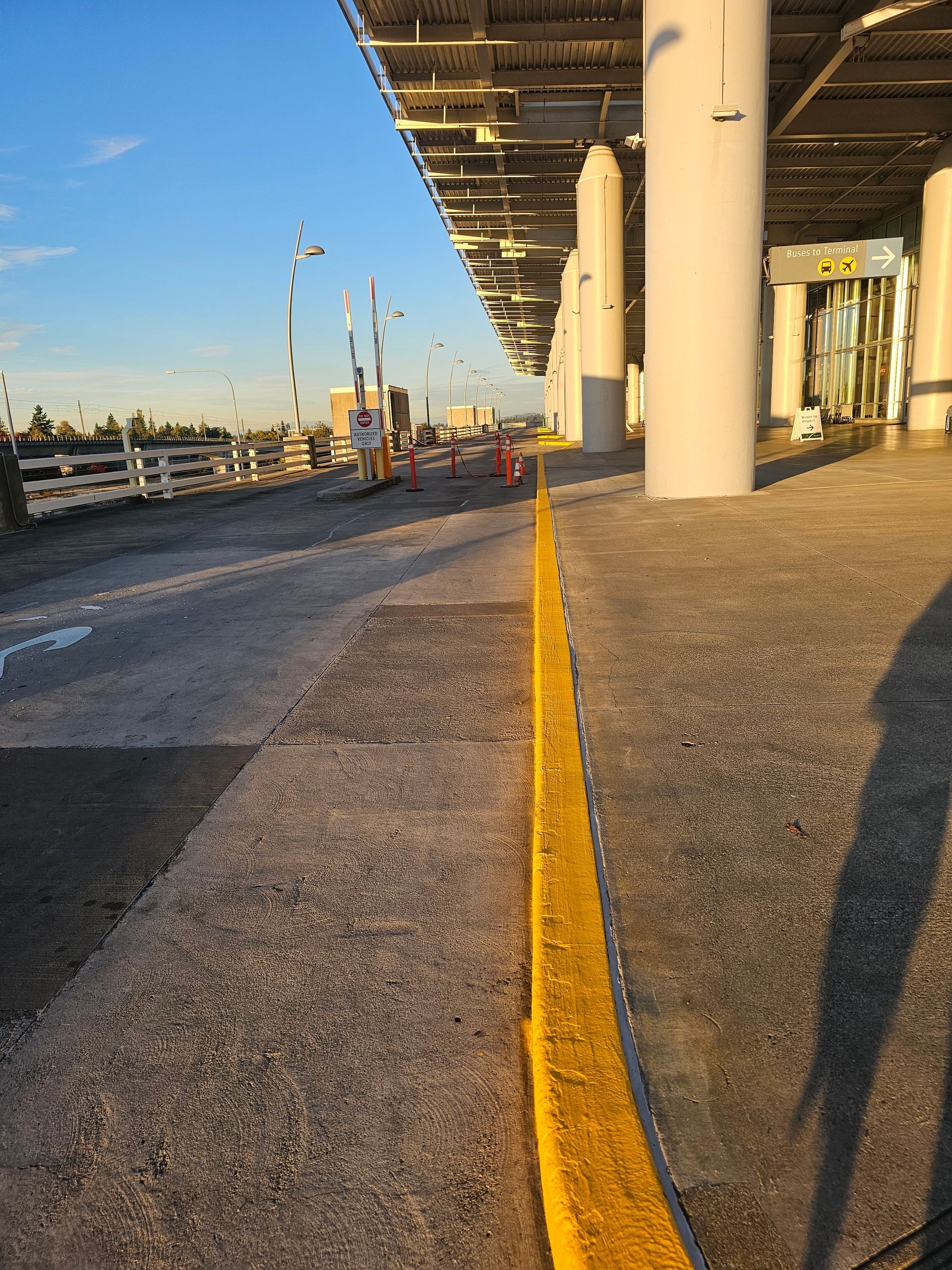 Wooden deck with various brown hues, with furniture visible in the background.