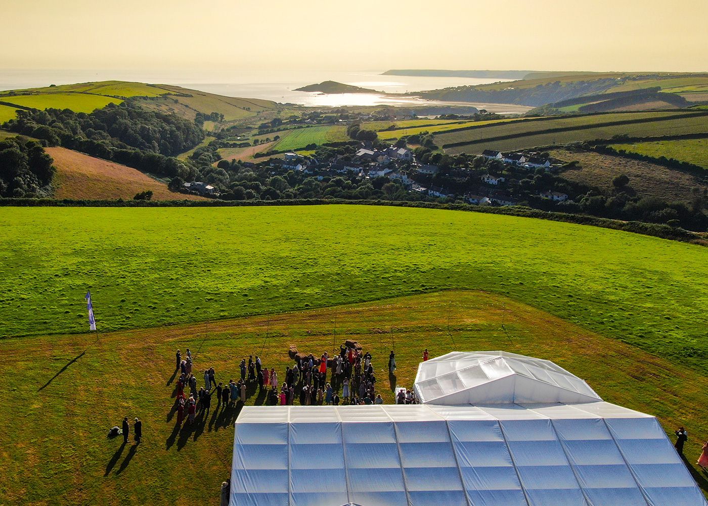 An aerial view of a group of people standing in a field.