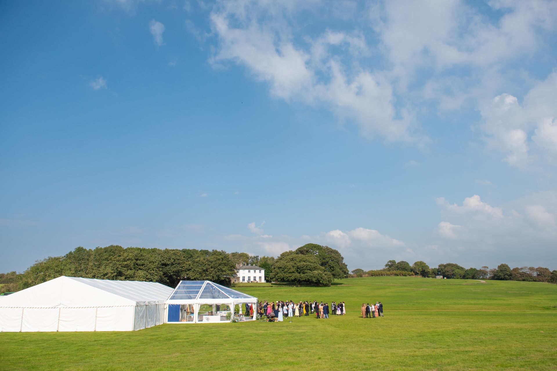 A large white tent with a wedding venue