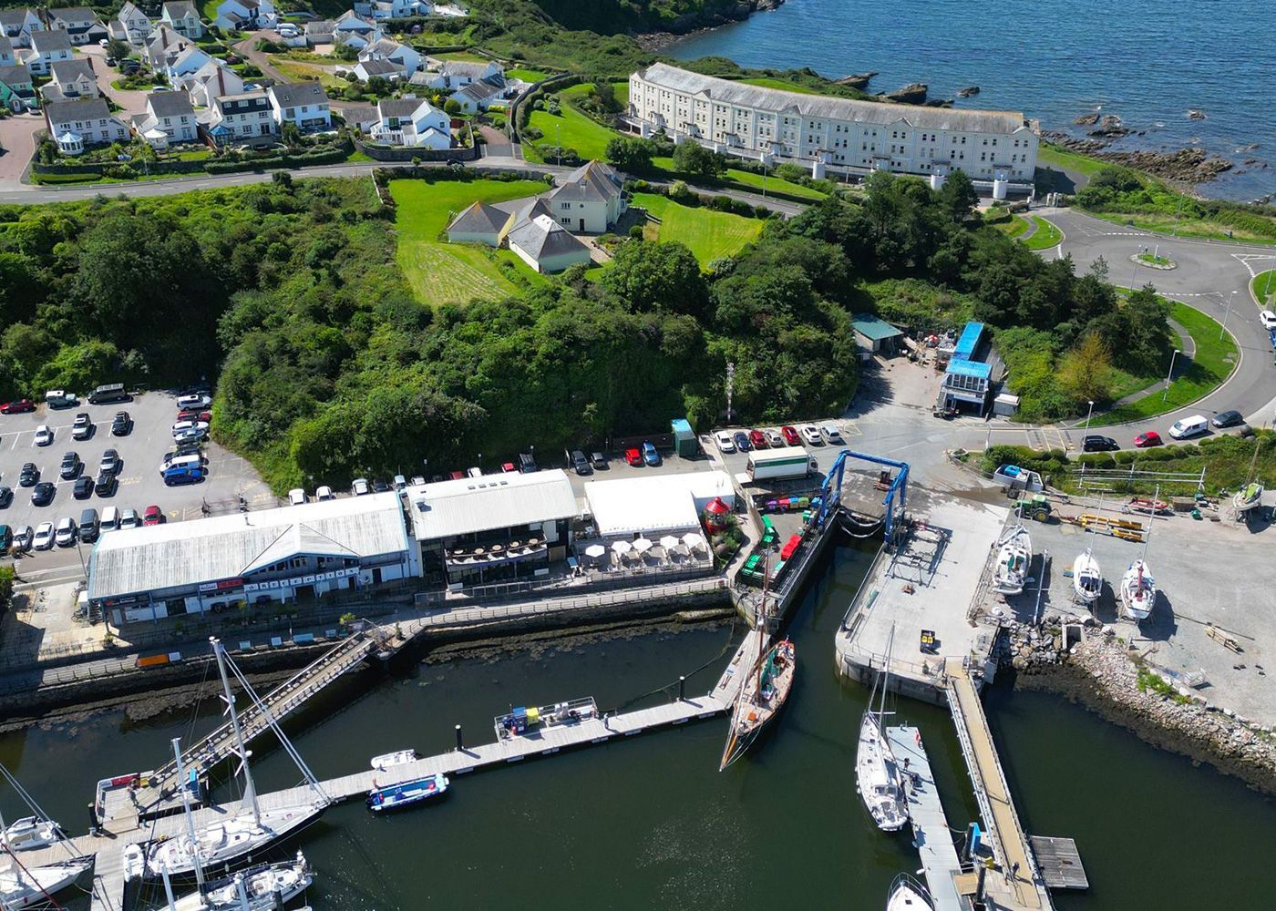An aerial view of a marina with boats docked in it