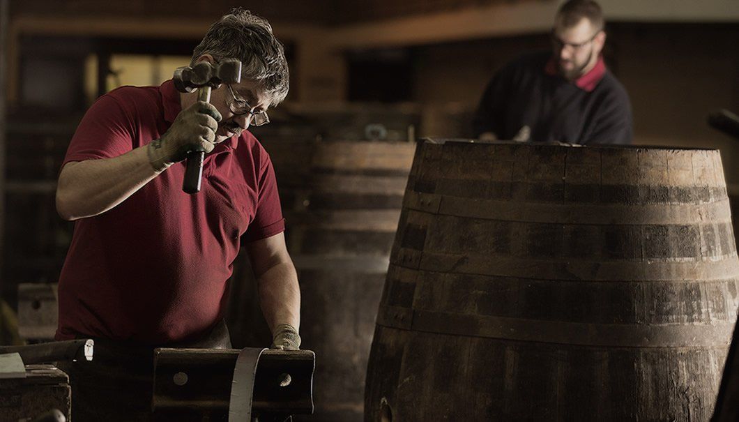 Man tapping a barrel