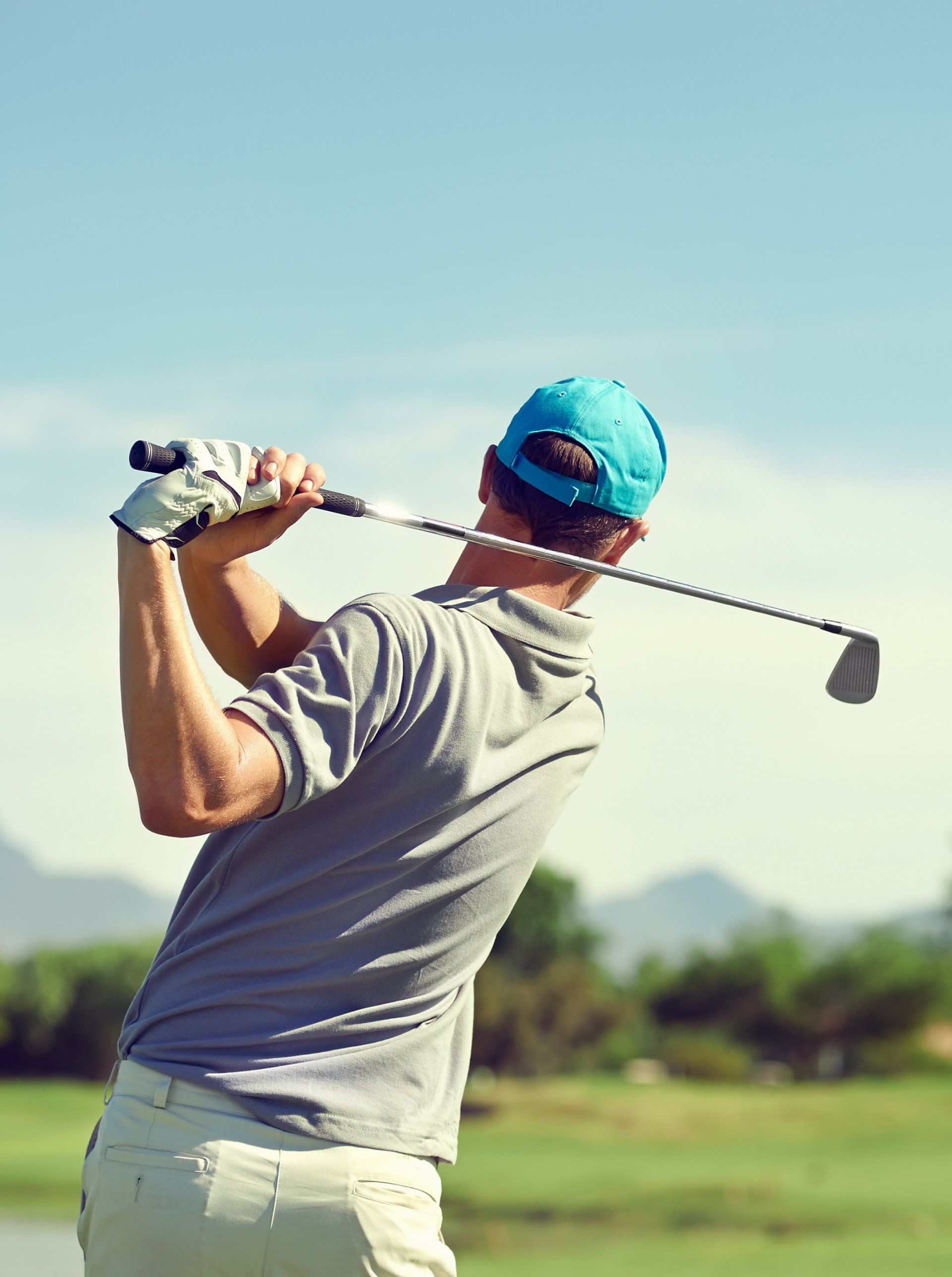 Man swinging a golf club