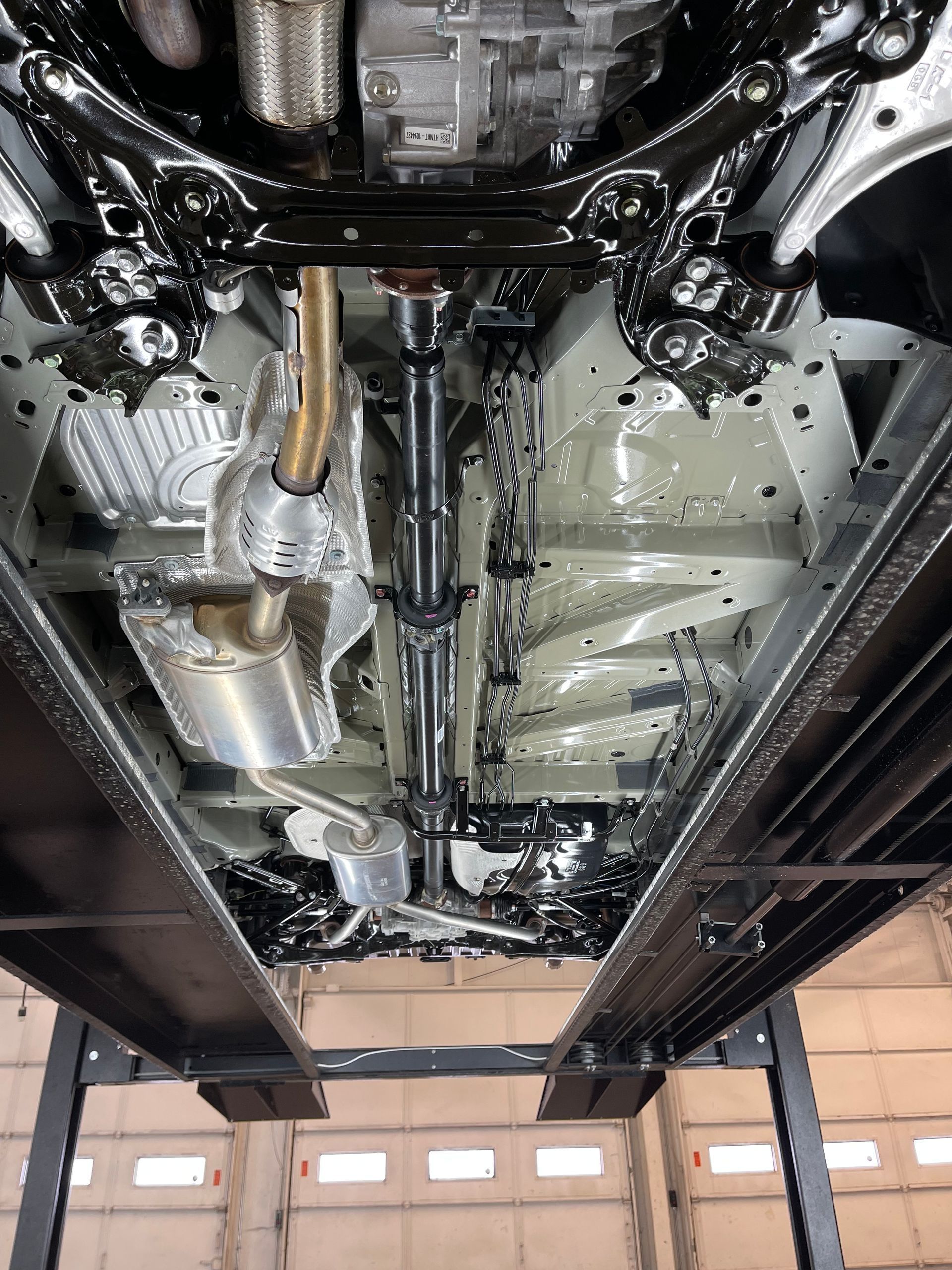 A car is being worked on in a garage.