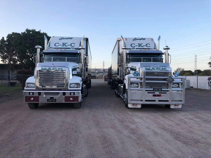 Two white freight trucks — About CKC Haulage in Townsville, QLD