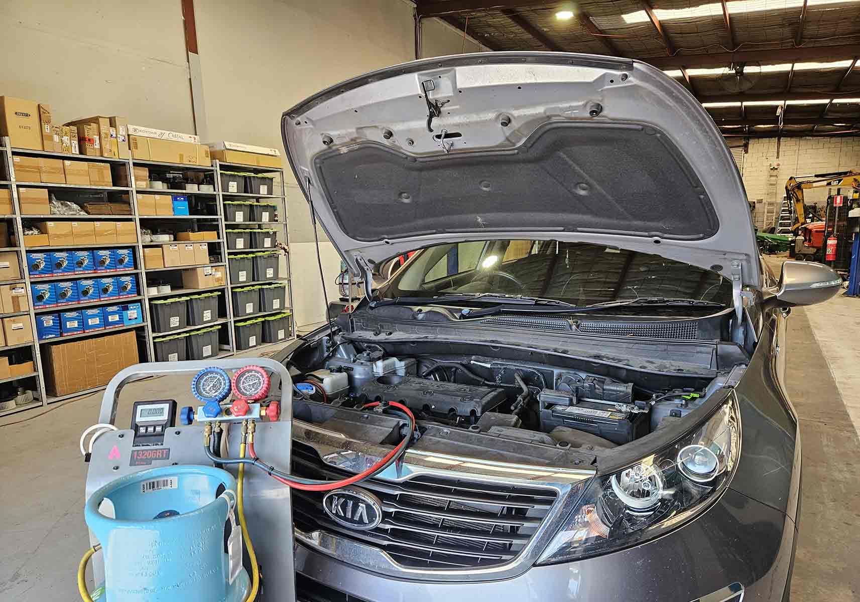 Car Serviced In A Garage With The Hood Open — Erina Car Air Conditioning In Erina, NSW