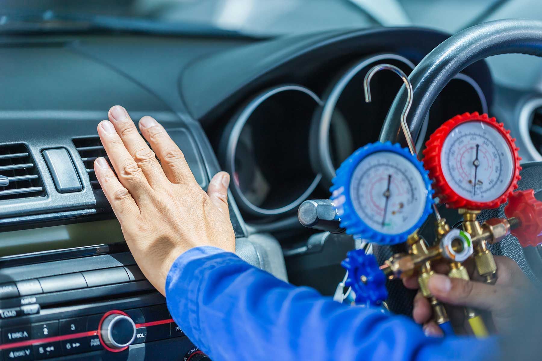Person Adjusting The Air Conditioner In A Car — Erina Car Air Conditioning In Terrigal, NSW
