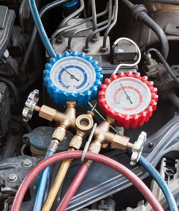 Close Up Of A Car Engine With Gauges And Hoses — Erina Car Air Conditioning In Gosford, NSW