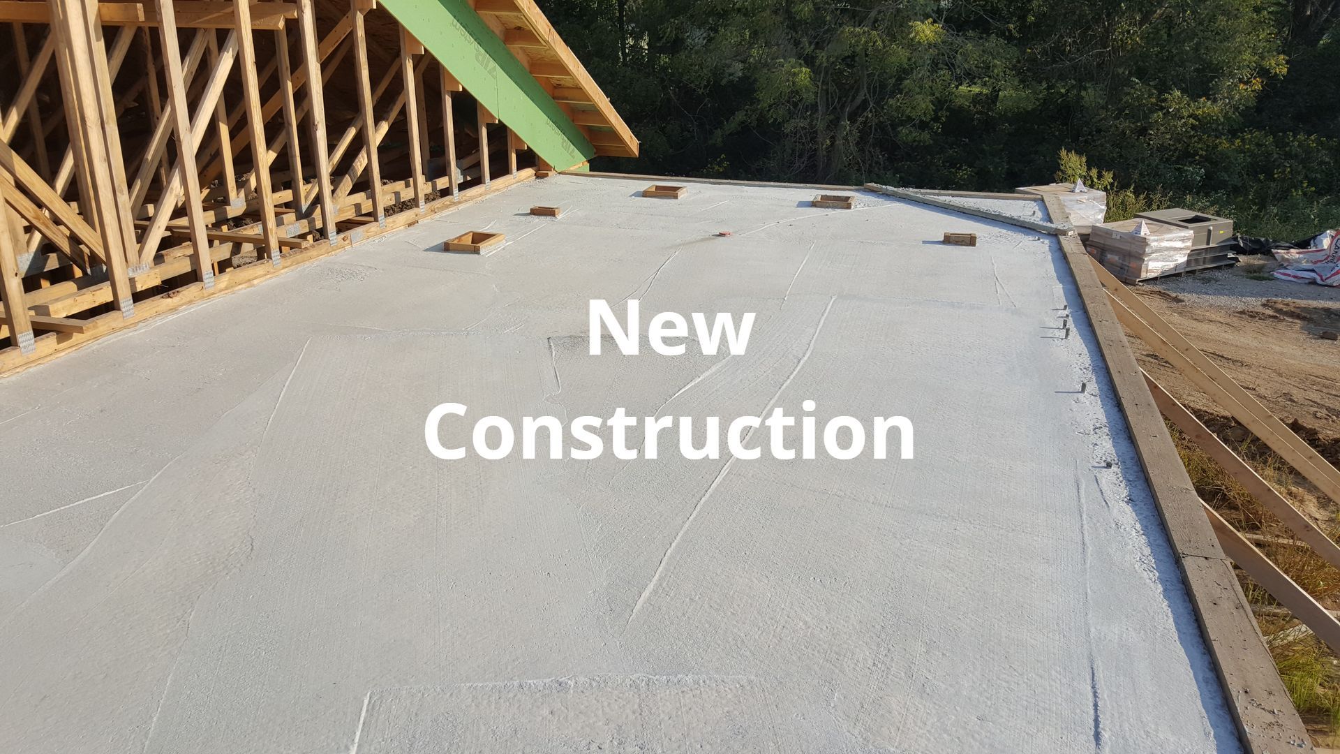 A construction site with the words `` new construction '' written on it.