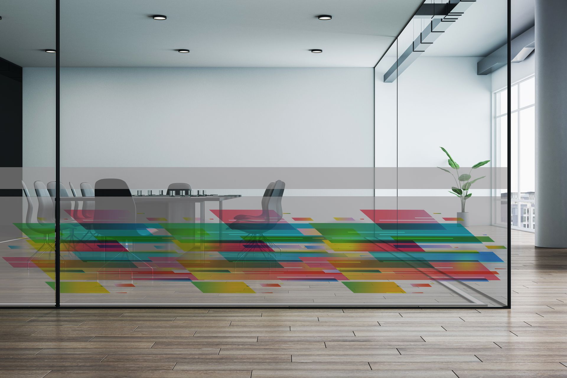 A room with a colorful rug on the floor and a glass wall.