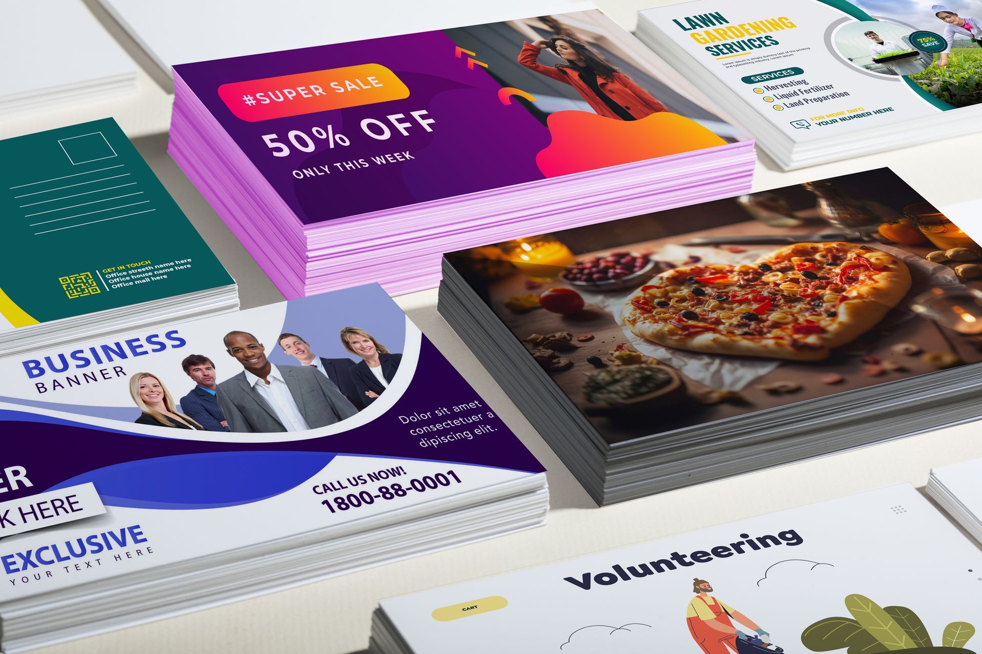 A bunch of business cards are stacked on top of each other on a table.