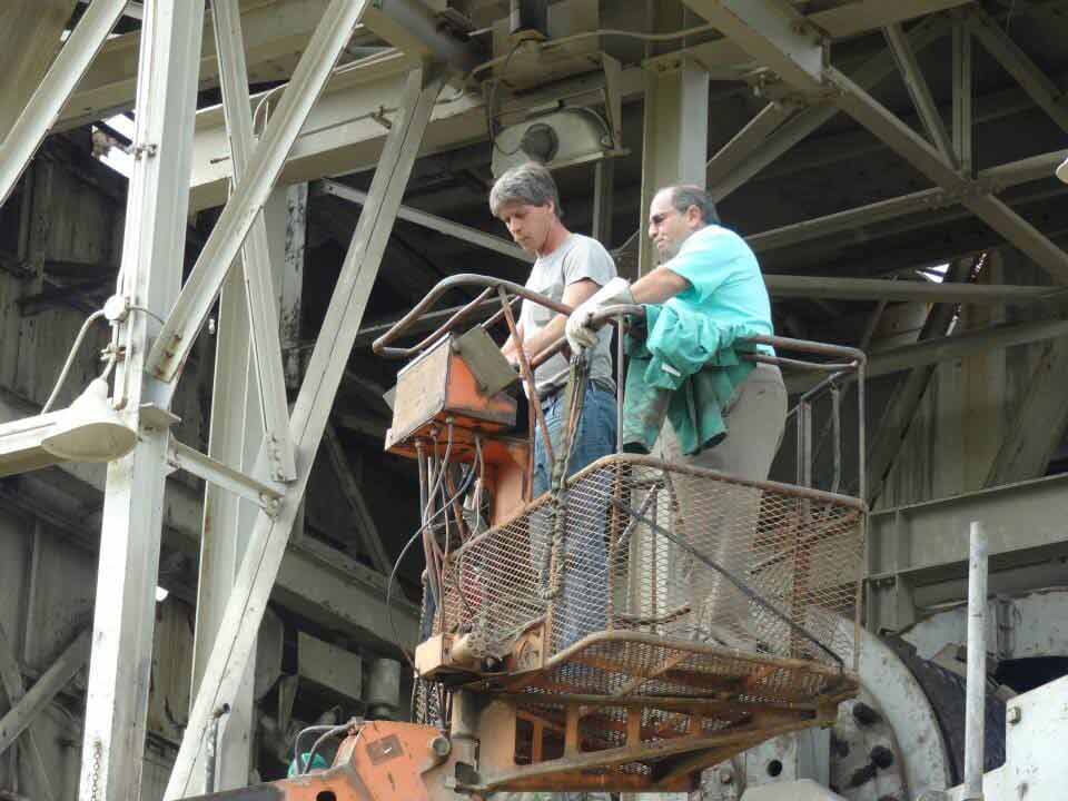 Metal recycling — two man in a bucket truck in Kittanning, PA