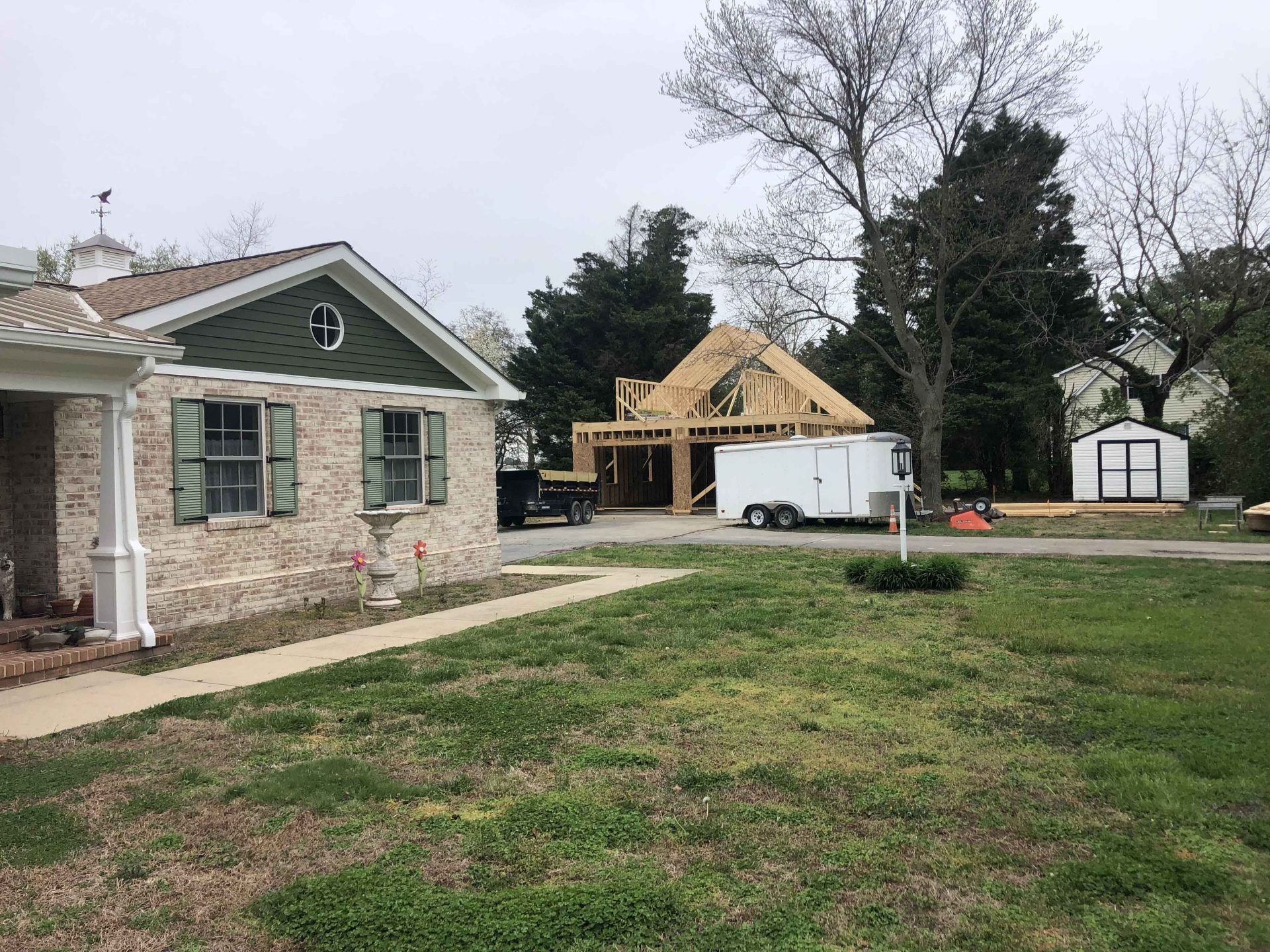 A house is being built in the middle of a residential neighborhood.