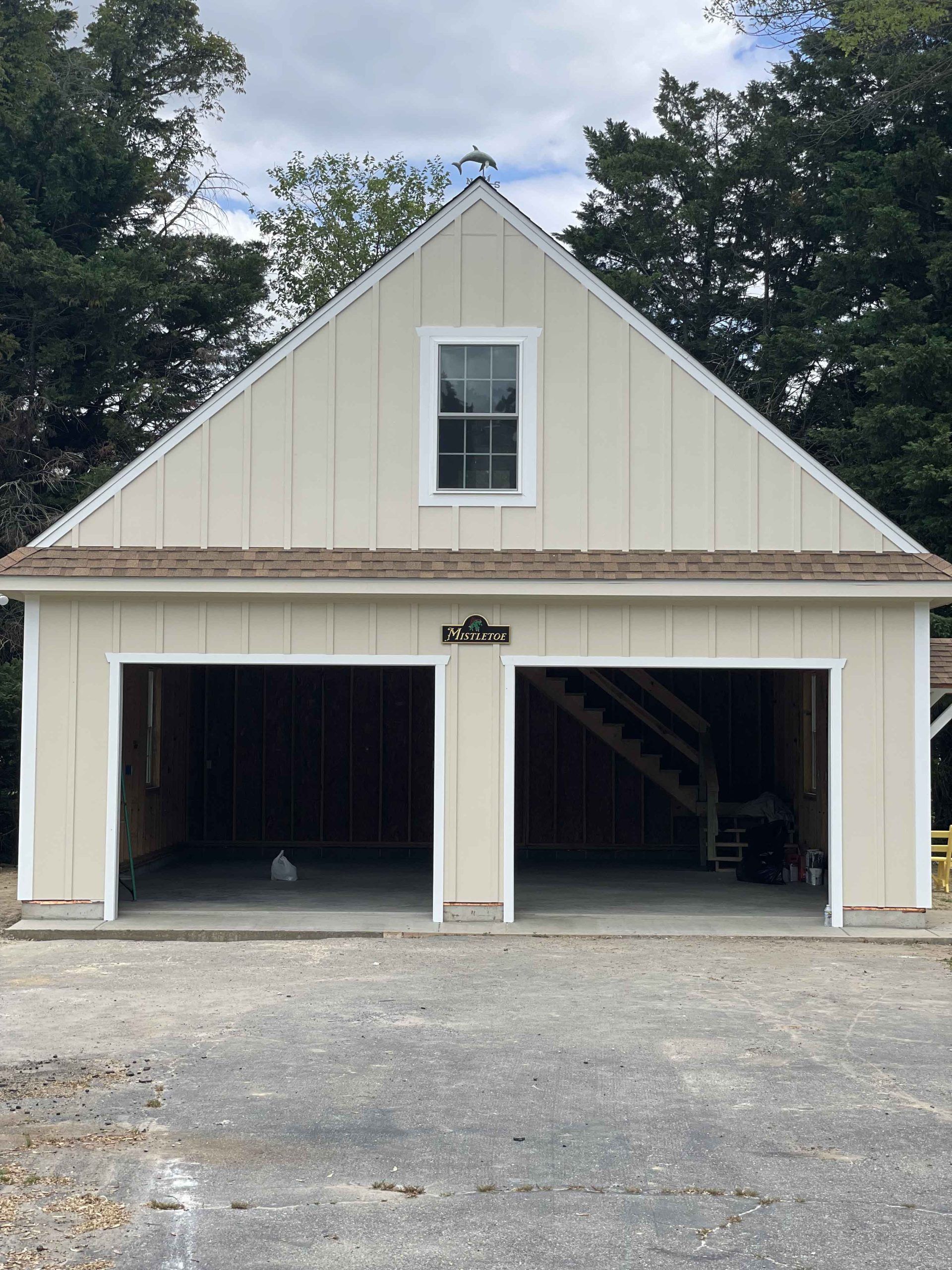 A white garage with two doors and a window