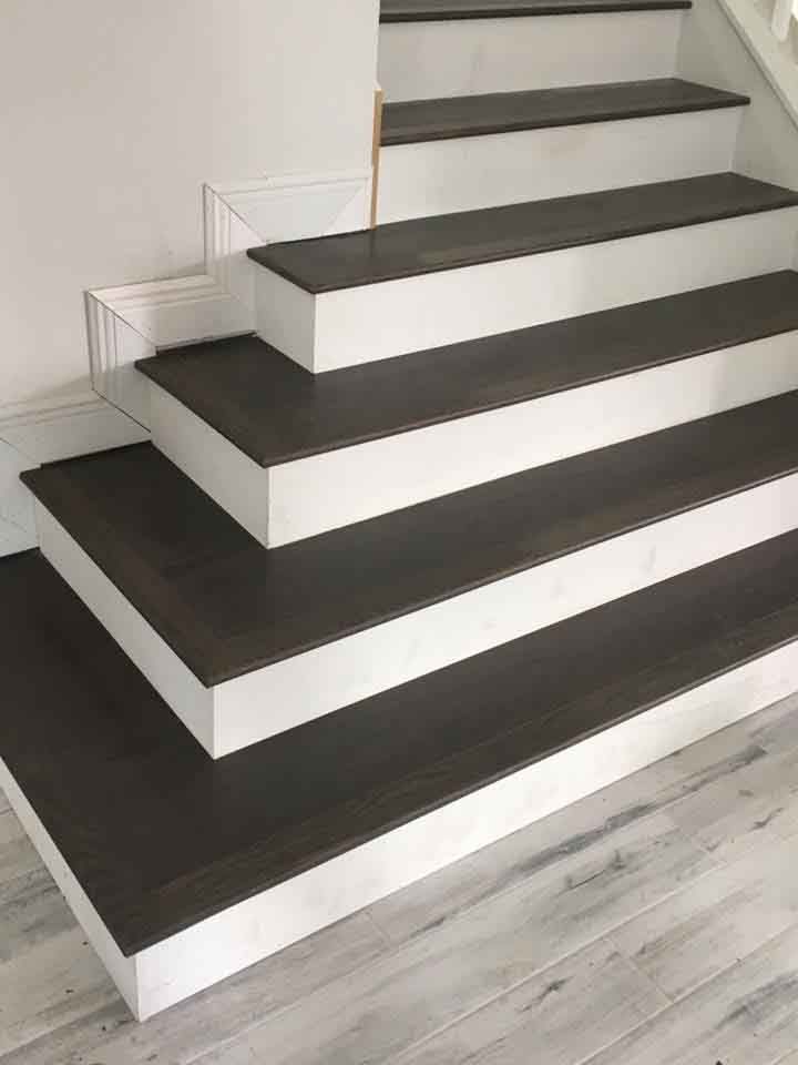 A set of stairs with wooden steps in a house.