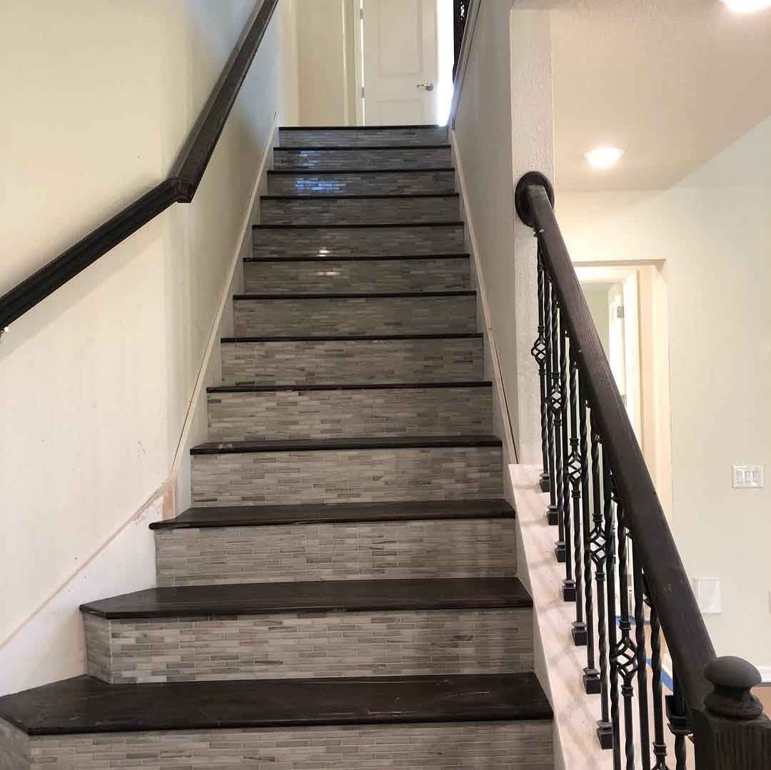 A set of stairs leading up to the second floor of a house.