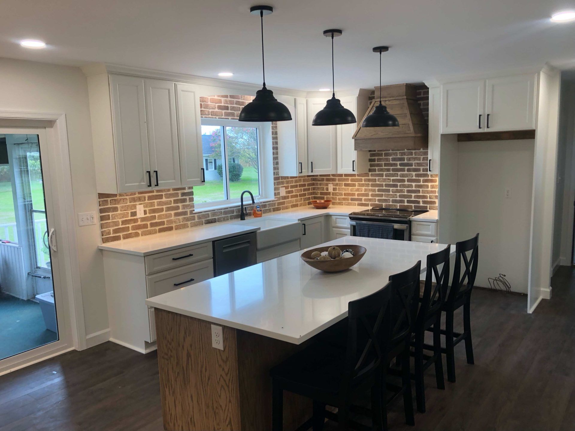 There is a large island in the middle of the kitchen.