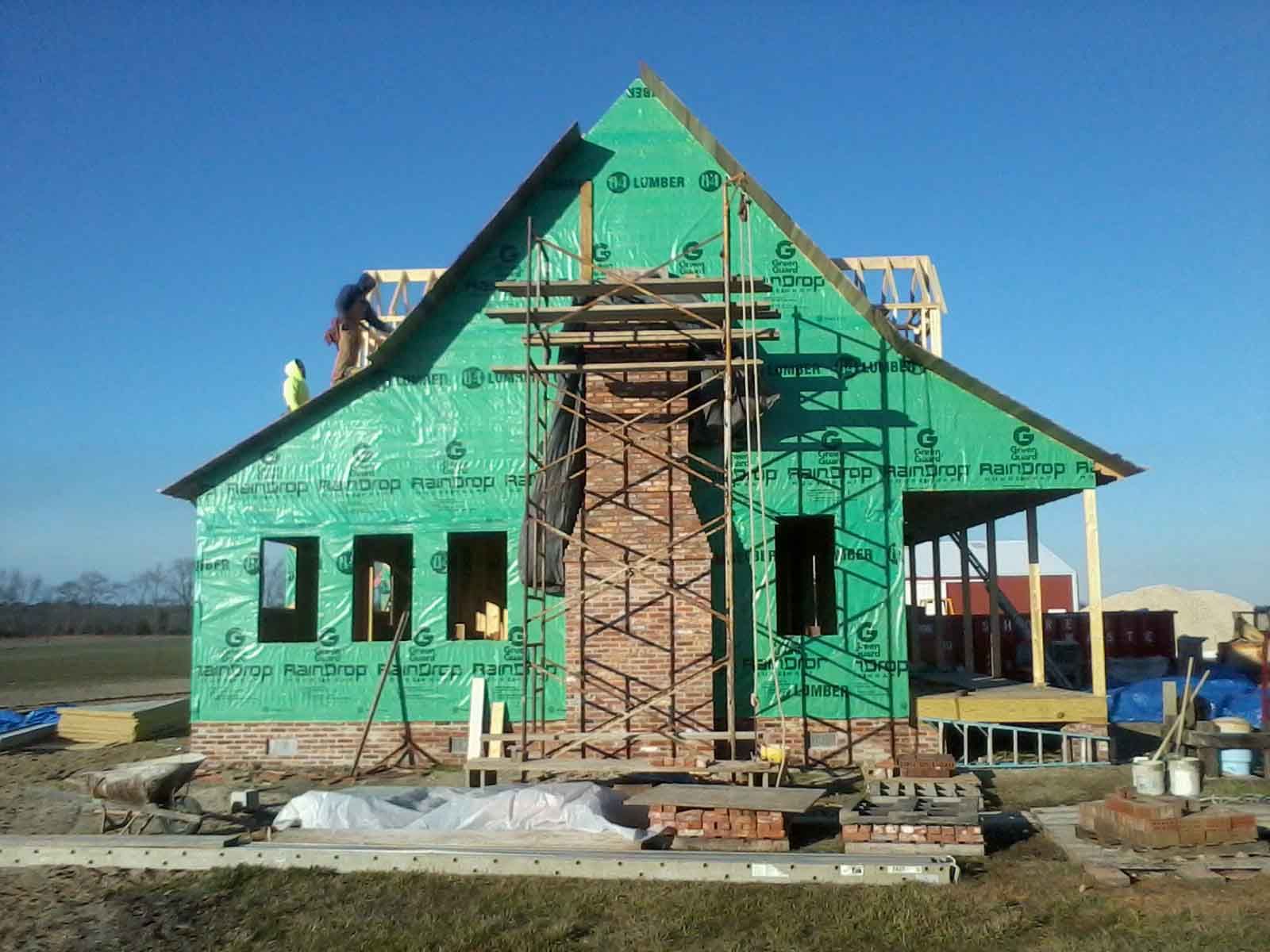 A house that is being built with a green roof